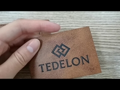 Desenho personalizado de alta qualidade Emblema de couro genuíno Logotipo em relevo costura em roupas PU adesivos de couro