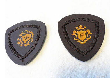 As calças de brim gravadas feitas sob encomenda personalizadas do remendo de couro cobrem a etiqueta do remendo para a roupa