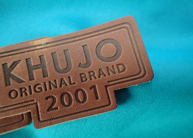 Etiquetas genuínas personalizadas e etiquetas do couro gravado do logotipo do metal para a roupa