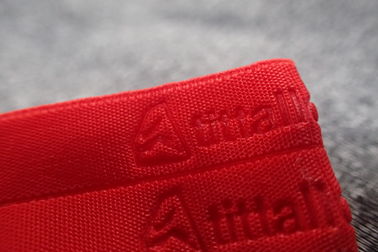 Faixa tecida Sportswear gravada vermelho