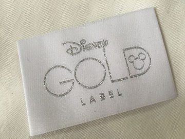 A roupa tecida dobra da extremidade de Bage do ouro de Disney etiqueta o corte frio/corte do calor